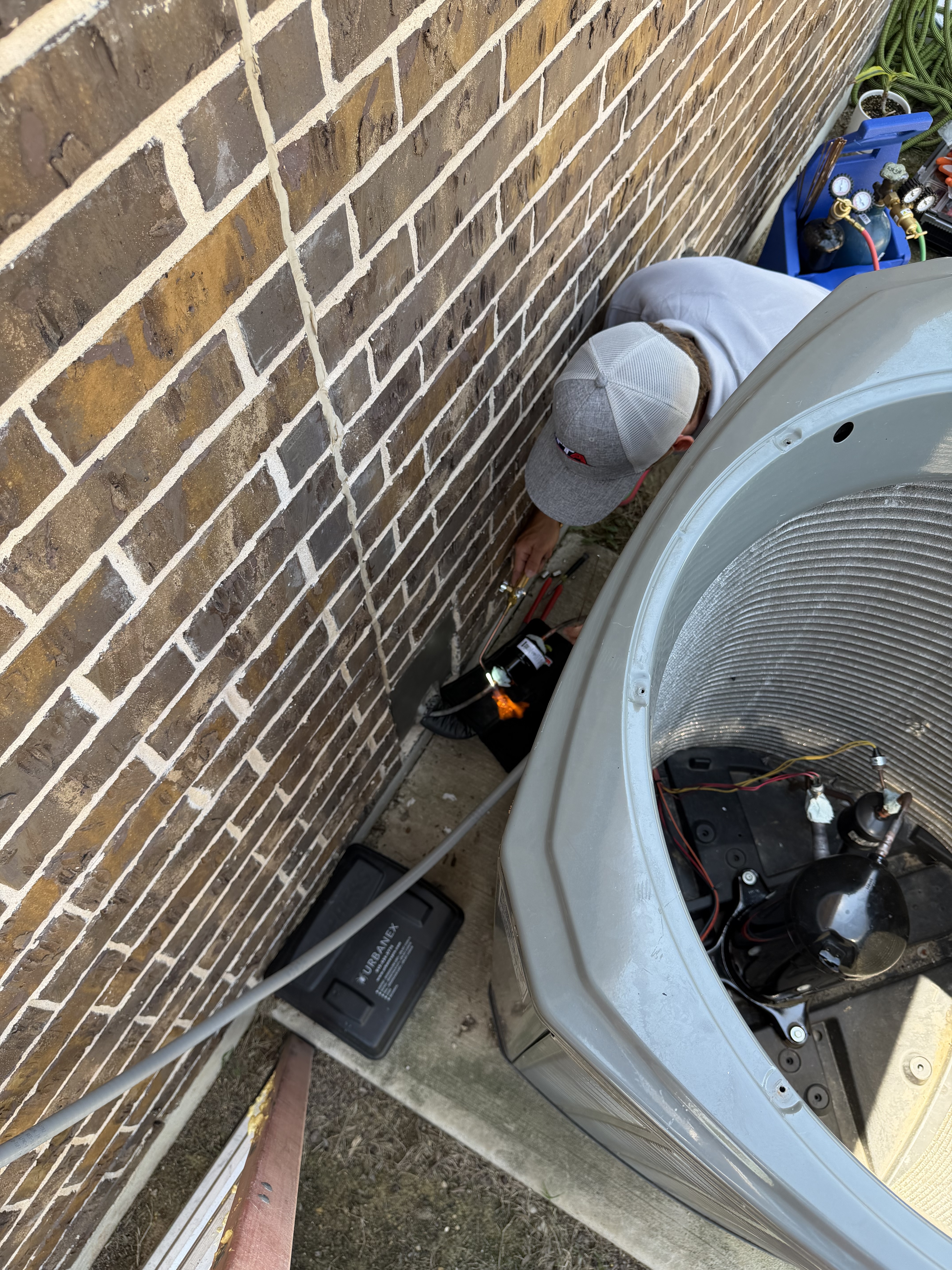 Taylor performing HVAC repair